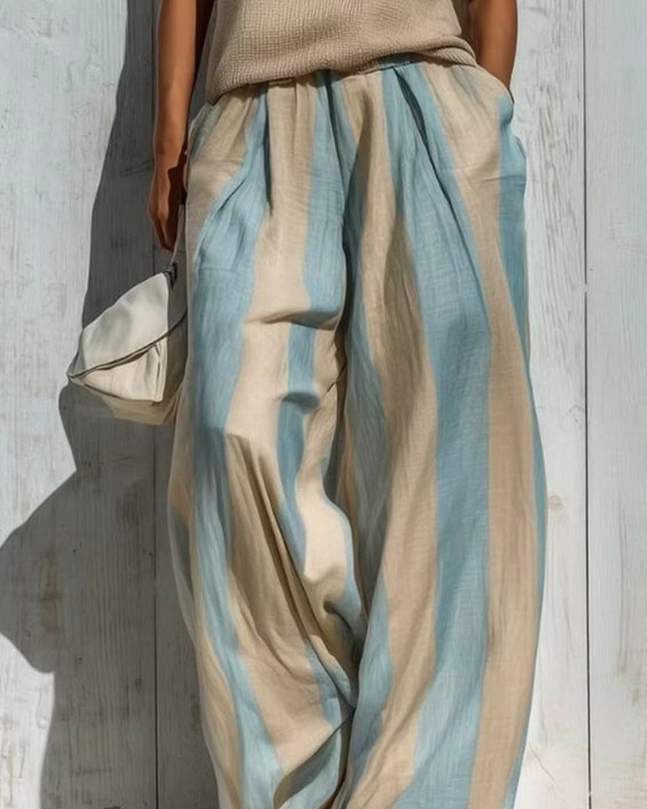 Alba completo — dettaglio del pantalone ampio a righe verticali in lino