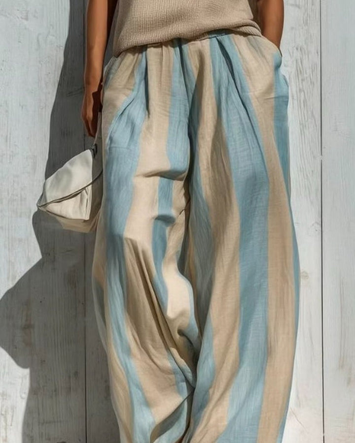Alba completo — dettaglio del pantalone ampio a righe verticali in lino